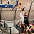 man holding ball dunk in ring