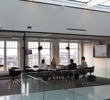 people sitting on chair inside building