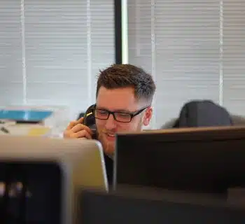 man using IP phone inside room